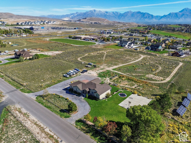 9044 North Cedar Pass Road Eagle Mountain, UT 84005 - Photo 59 of 63 Expansive property featuring a circular driveway, a basketball court, and solar panels