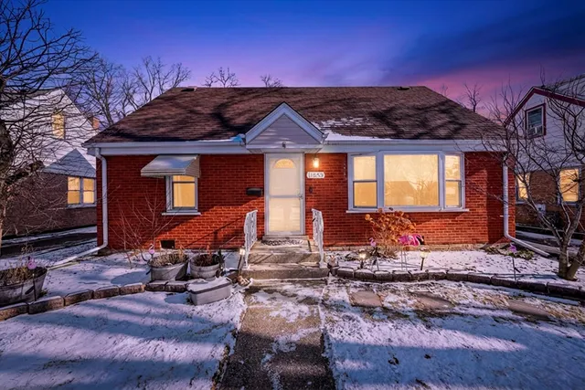 a front view of a house with sitting area