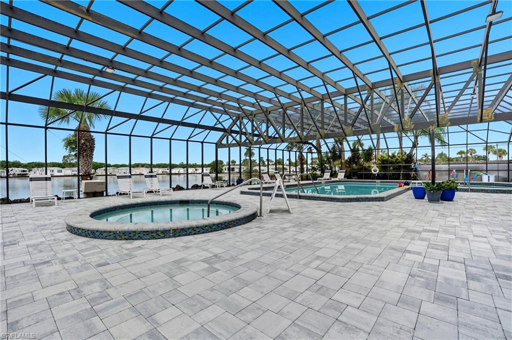 37 Bass Lane Naples, FL 34114 - Photo 23 of 29 Community pool with a community spa, a lanai, and a patio area