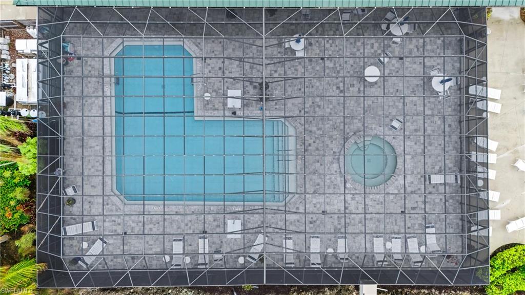 37 Bass Lane Naples, FL 34114 - Photo 24 of 29 Drone / aerial view of screen community pool and spa