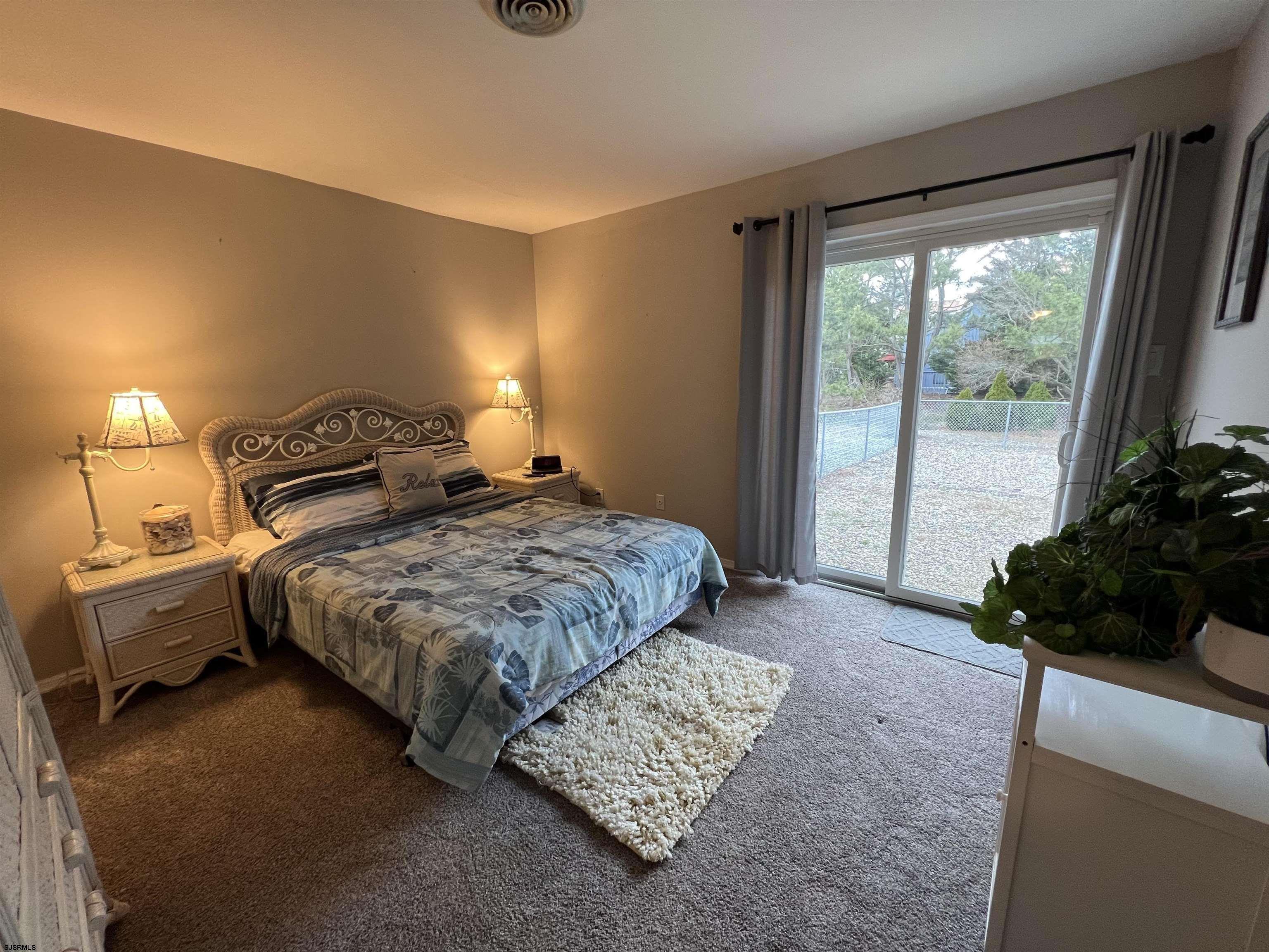 11 Surfside Road, Unit 11 Brigantine, NJ 08203 - Photo 11 of 21 a bedroom with a bed and a window