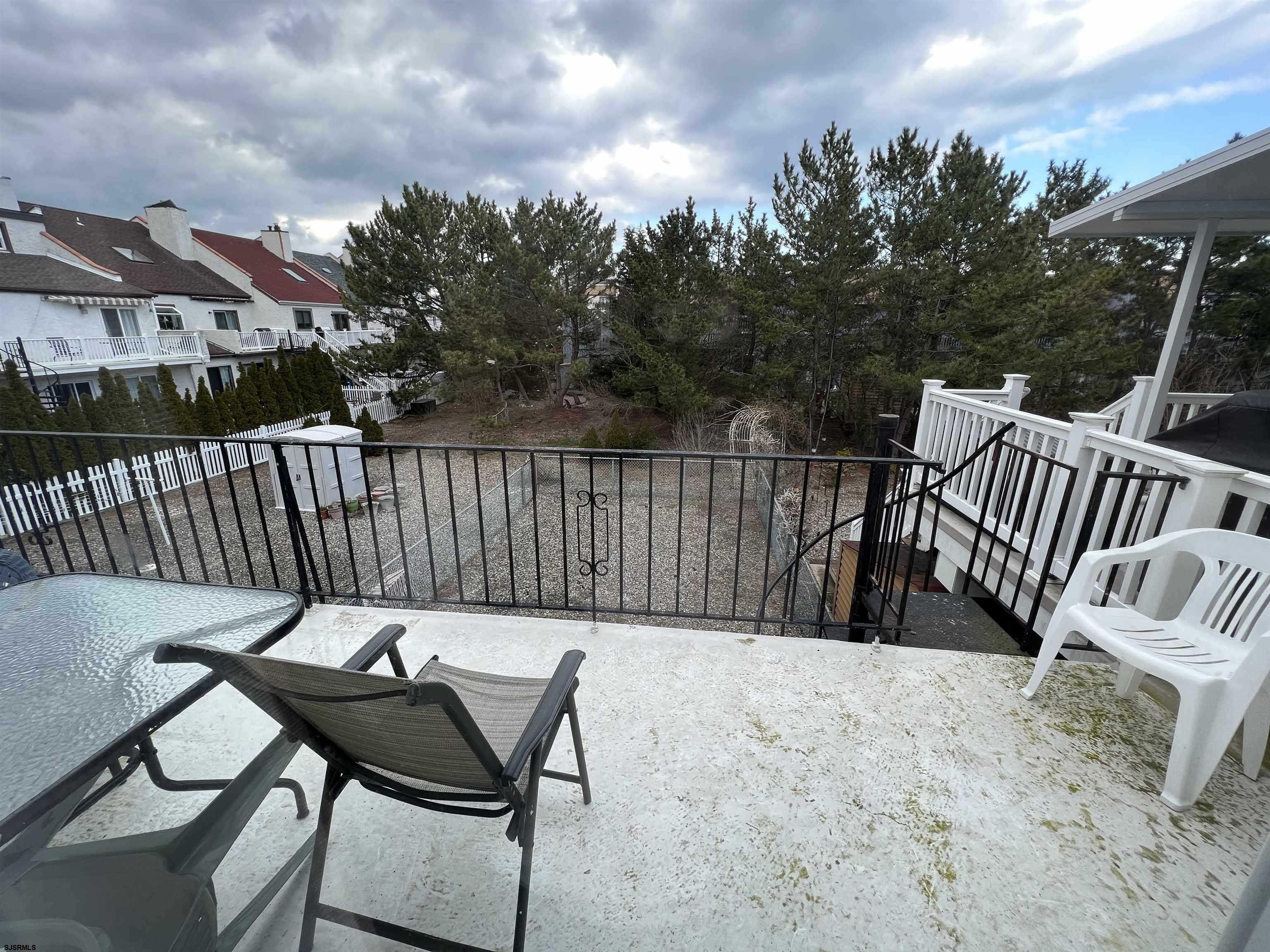 11 Surfside Road, Unit 11 Brigantine, NJ 08203 - Photo 16 of 21 a view of a chairs and table in the patio