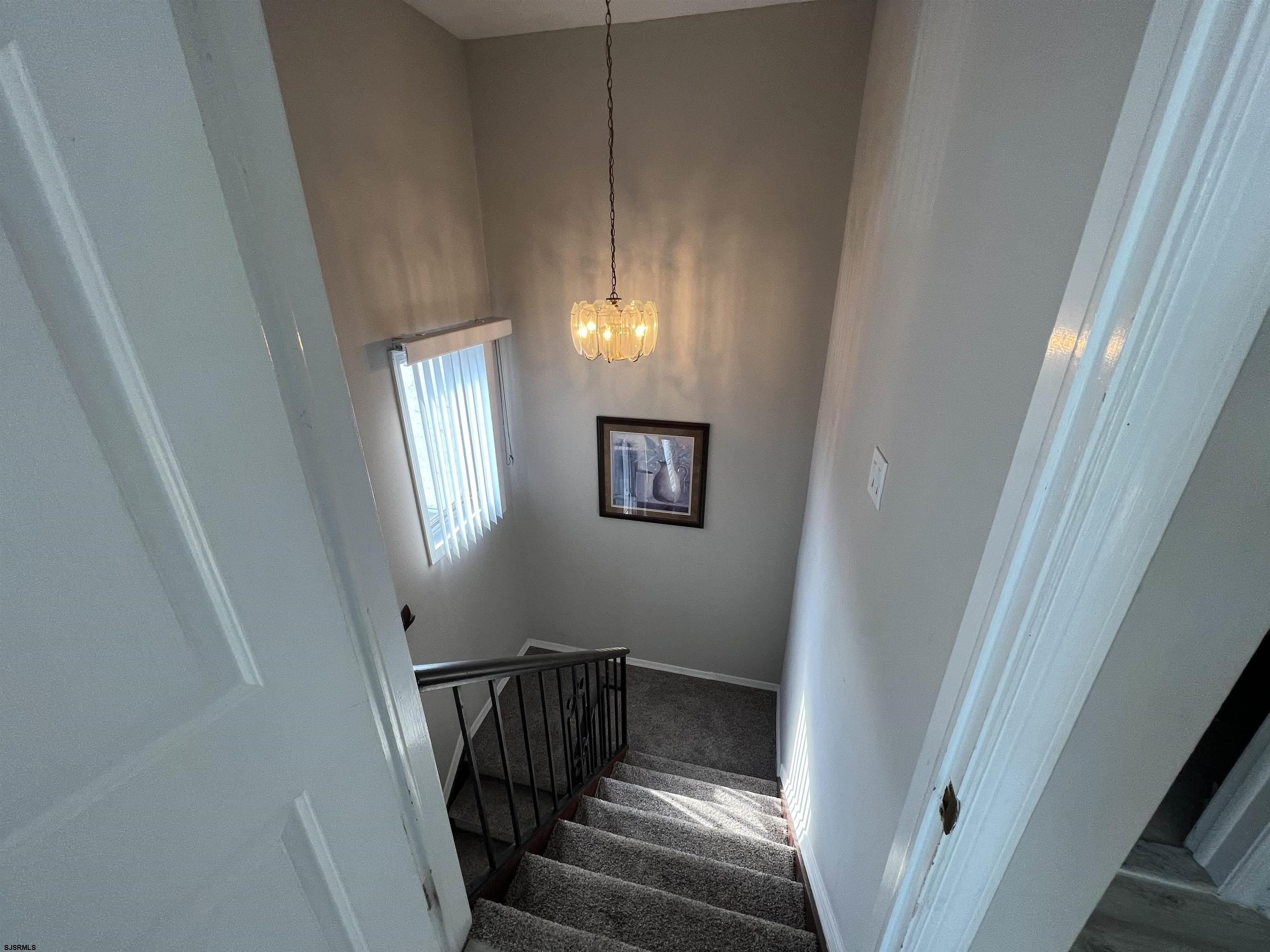 11 Surfside Road, Unit 11 Brigantine, NJ 08203 - Photo 6 of 21 a view of entryway and hall with wooden floor