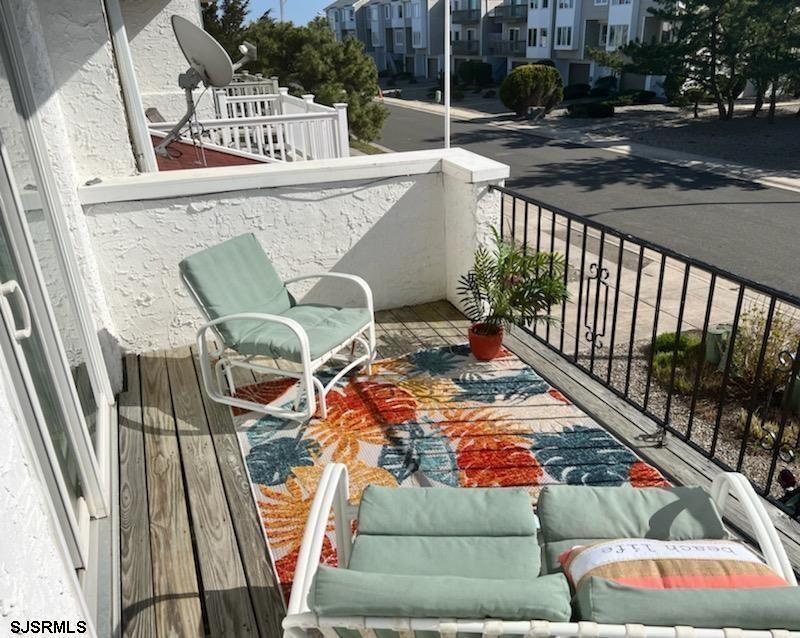 11 Surfside Road, Unit 11 Brigantine, NJ 08203 - Photo 7 of 21 a balcony with table and chairs