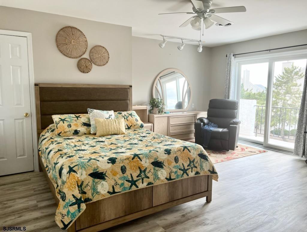 11 Surfside Road, Unit 11 Brigantine, NJ 08203 - Photo 9 of 21 a bedroom with a bed and window
