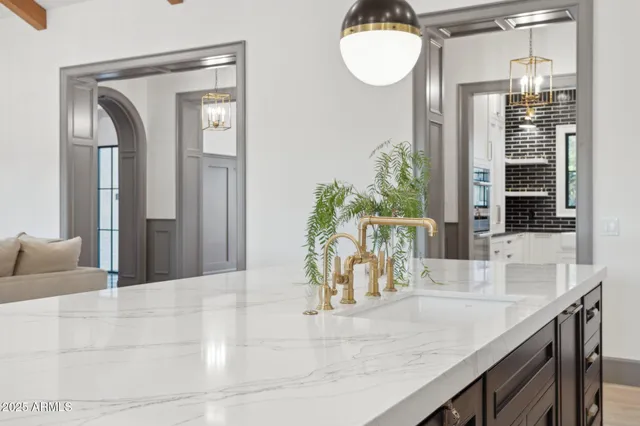 a view of a kitchen with granite countertop a living room