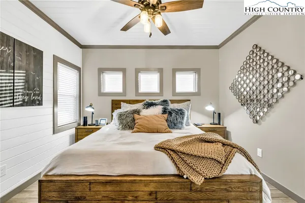 a bed room with bed and window