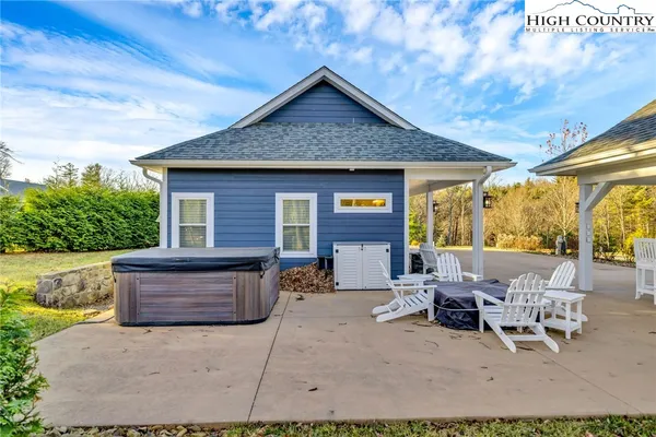 a view of a patio with a table and chairs