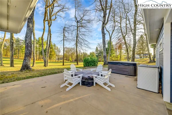 a view of a patio with couches chairs and potted plants