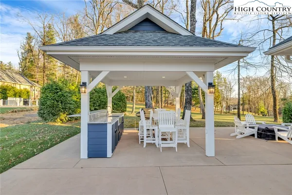 a view of a patio with a table and chairs