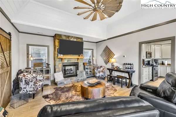a living room with furniture and a fireplace