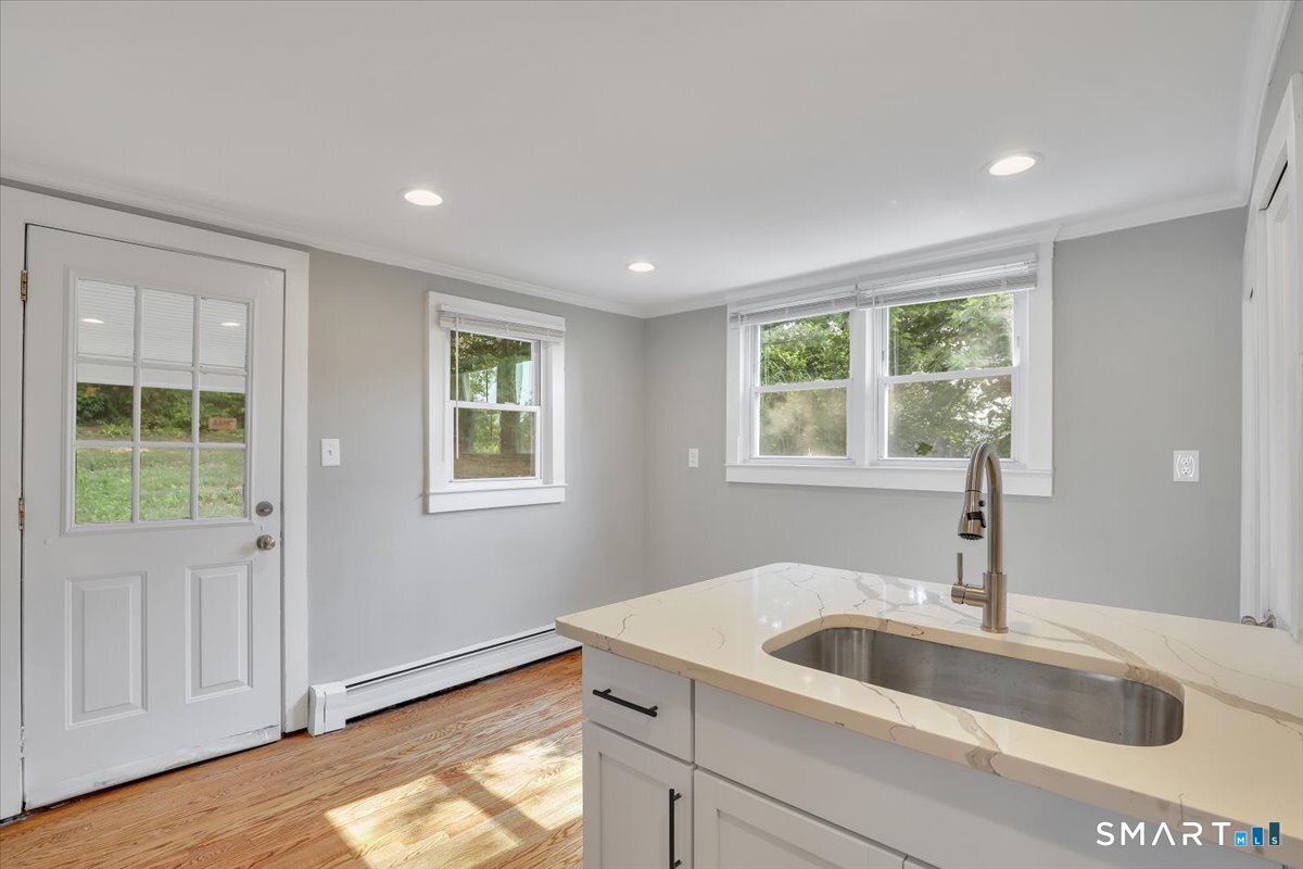 16 Strong Street Burlington, CT 06013 - Photo 12 of 36 a kitchen with a sink and a window