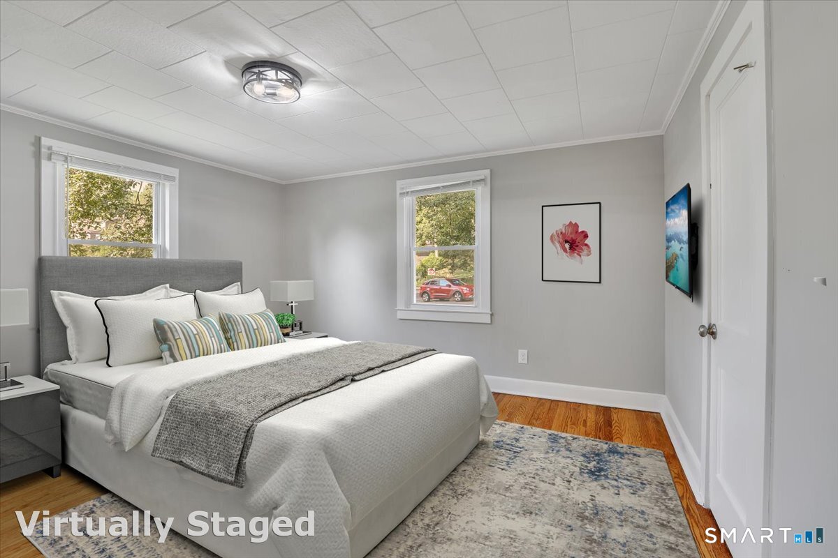 16 Strong Street Burlington, CT 06013 - Photo 13 of 36 a bedroom with a bed and a couch