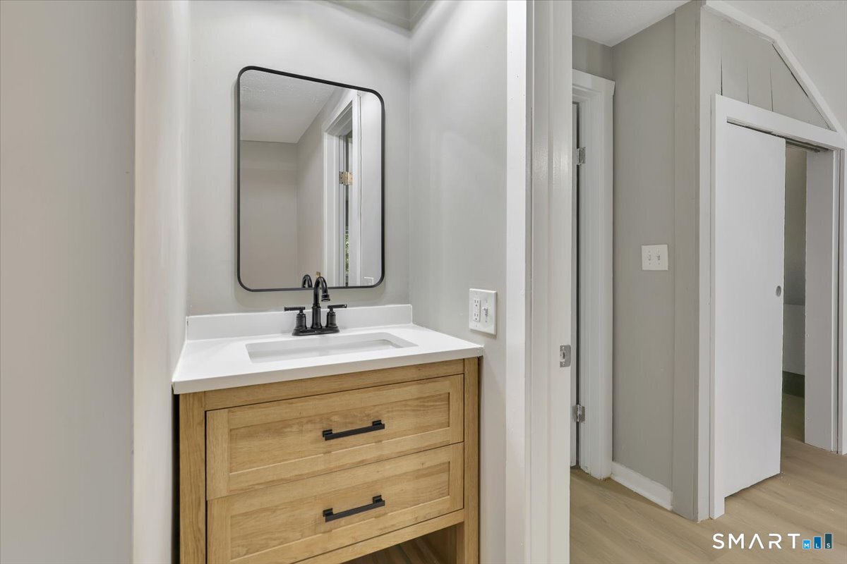 16 Strong Street Burlington, CT 06013 - Photo 17 of 36 a bathroom with a sink and a mirror