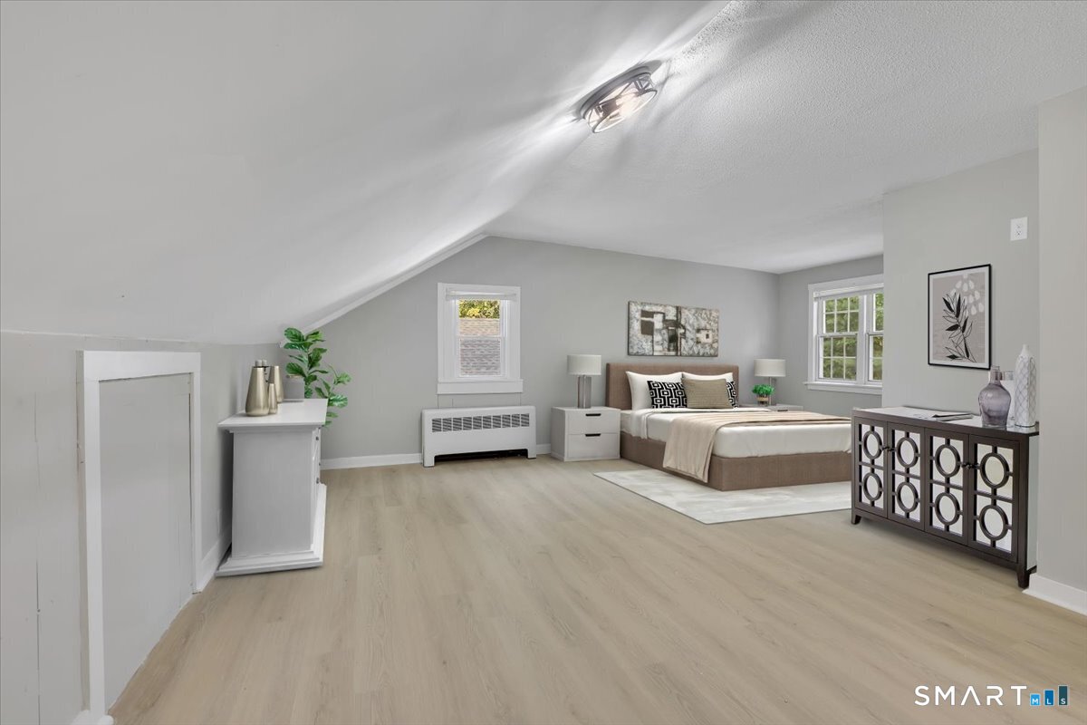 16 Strong Street Burlington, CT 06013 - Photo 19 of 36 a living room with furniture and a lamp