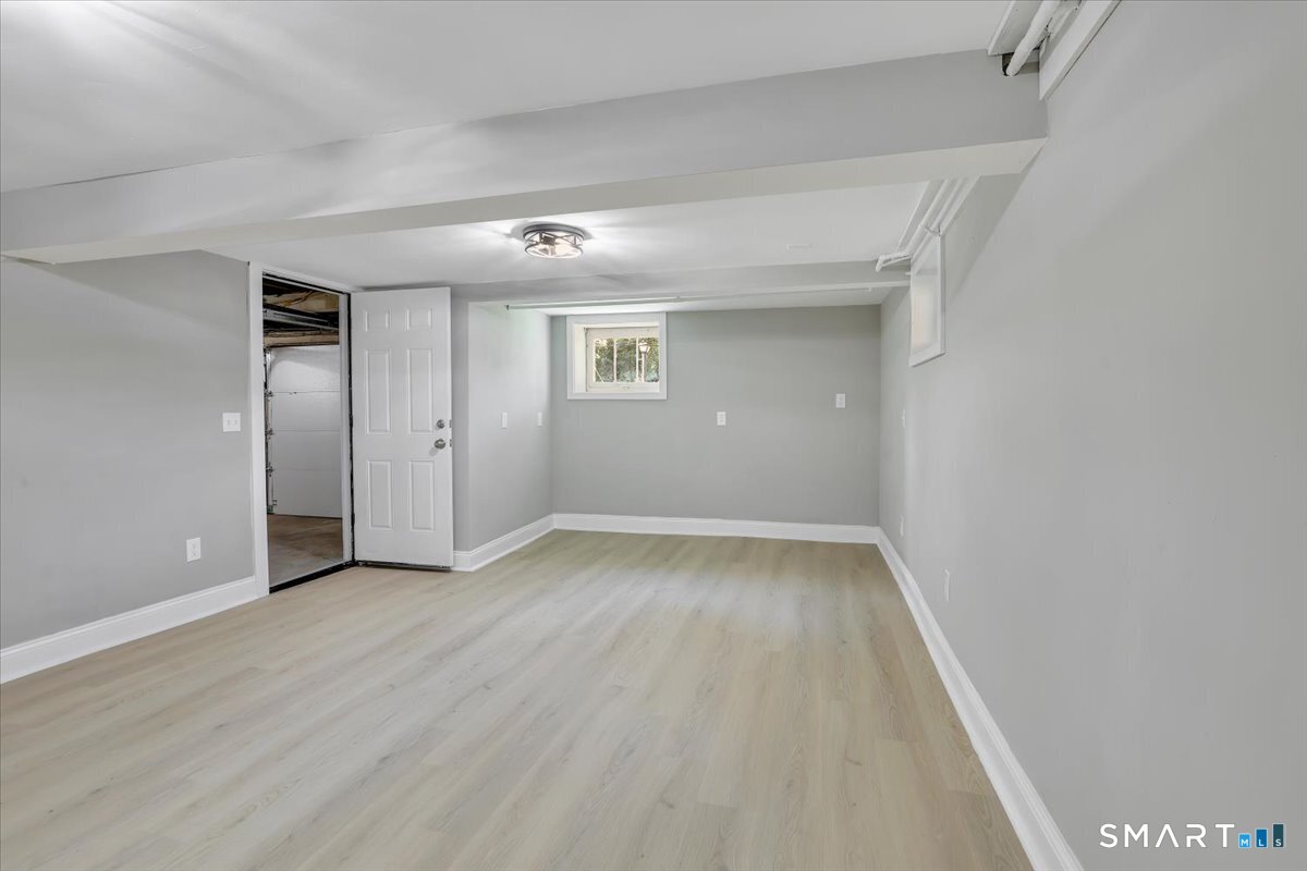 16 Strong Street Burlington, CT 06013 - Photo 27 of 36 an empty room with wooden floor and windows
