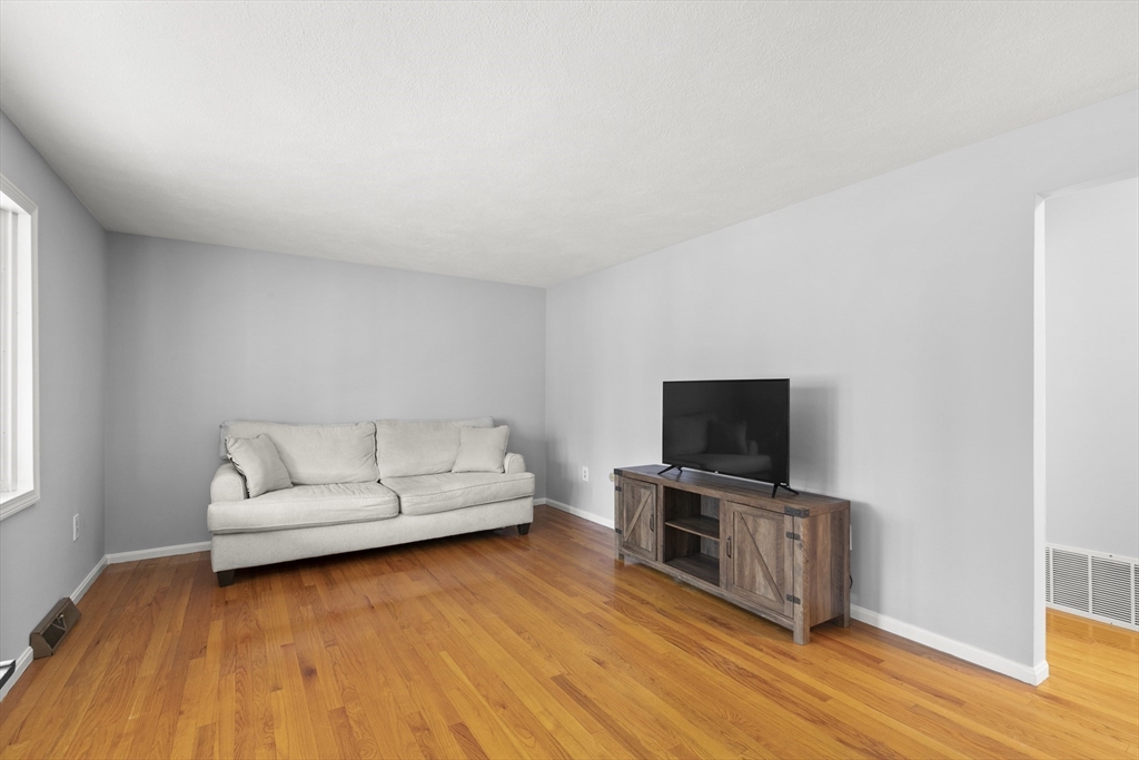 36 Emery Road Townsend, MA 01469 - Photo 22 of 40 a living room with furniture and a flat screen tv