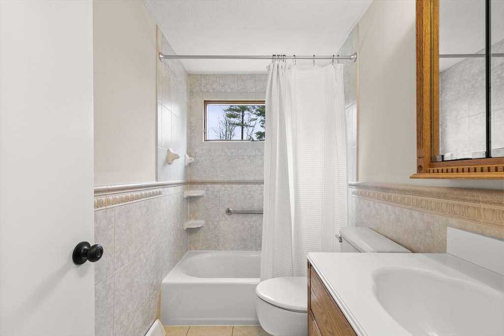 36 Emery Road Townsend, MA 01469 - Photo 26 of 40 a bathroom with a sink a toilet and shower