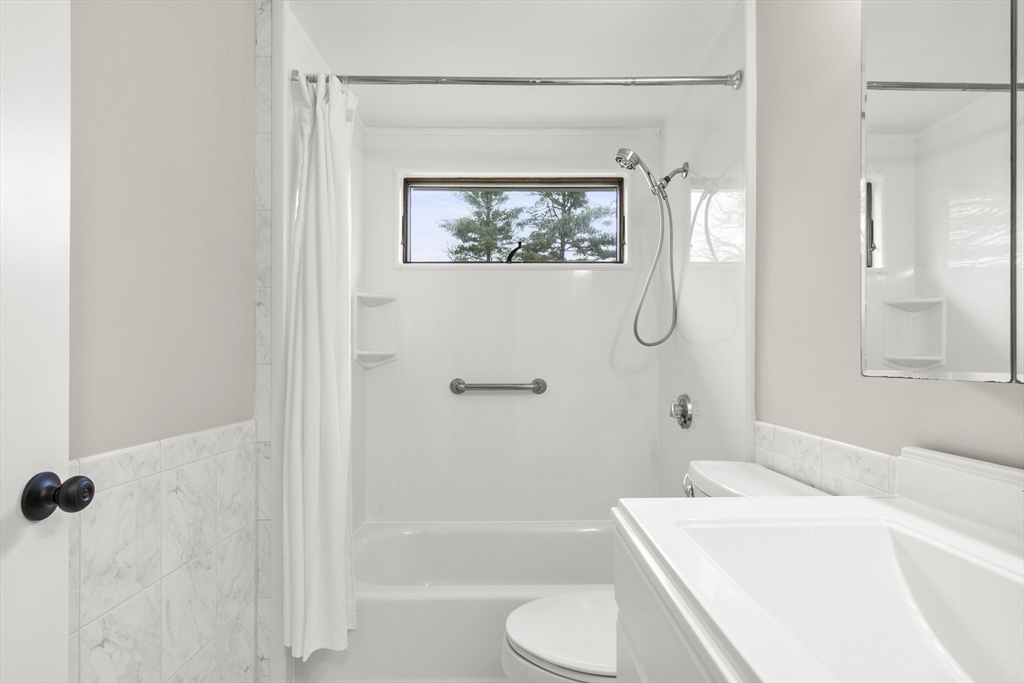 36 Emery Road Townsend, MA 01469 - Photo 32 of 40 a bathroom with a sink a toilet and shower
