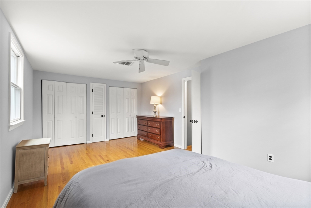 36 Emery Road Townsend, MA 01469 - Photo 34 of 40 a bedroom with a bed and a chandelier