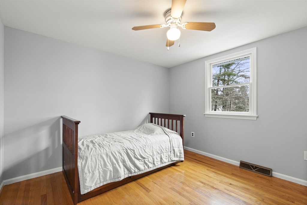 36 Emery Road Townsend, MA 01469 - Photo 38 of 40 a bedroom with a bed and a window