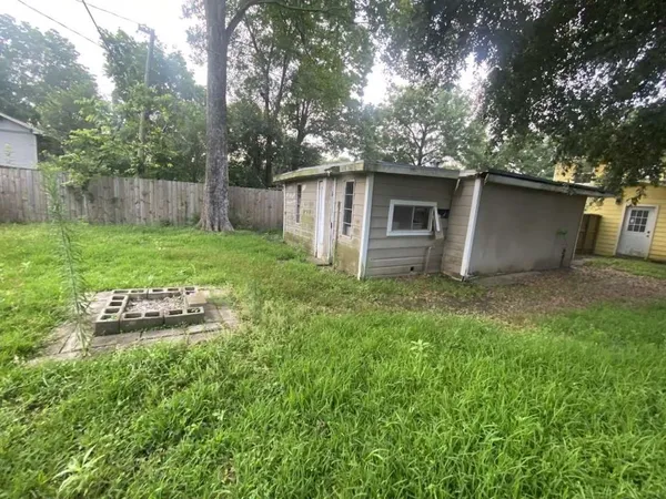 a backyard of a house with lots of green space