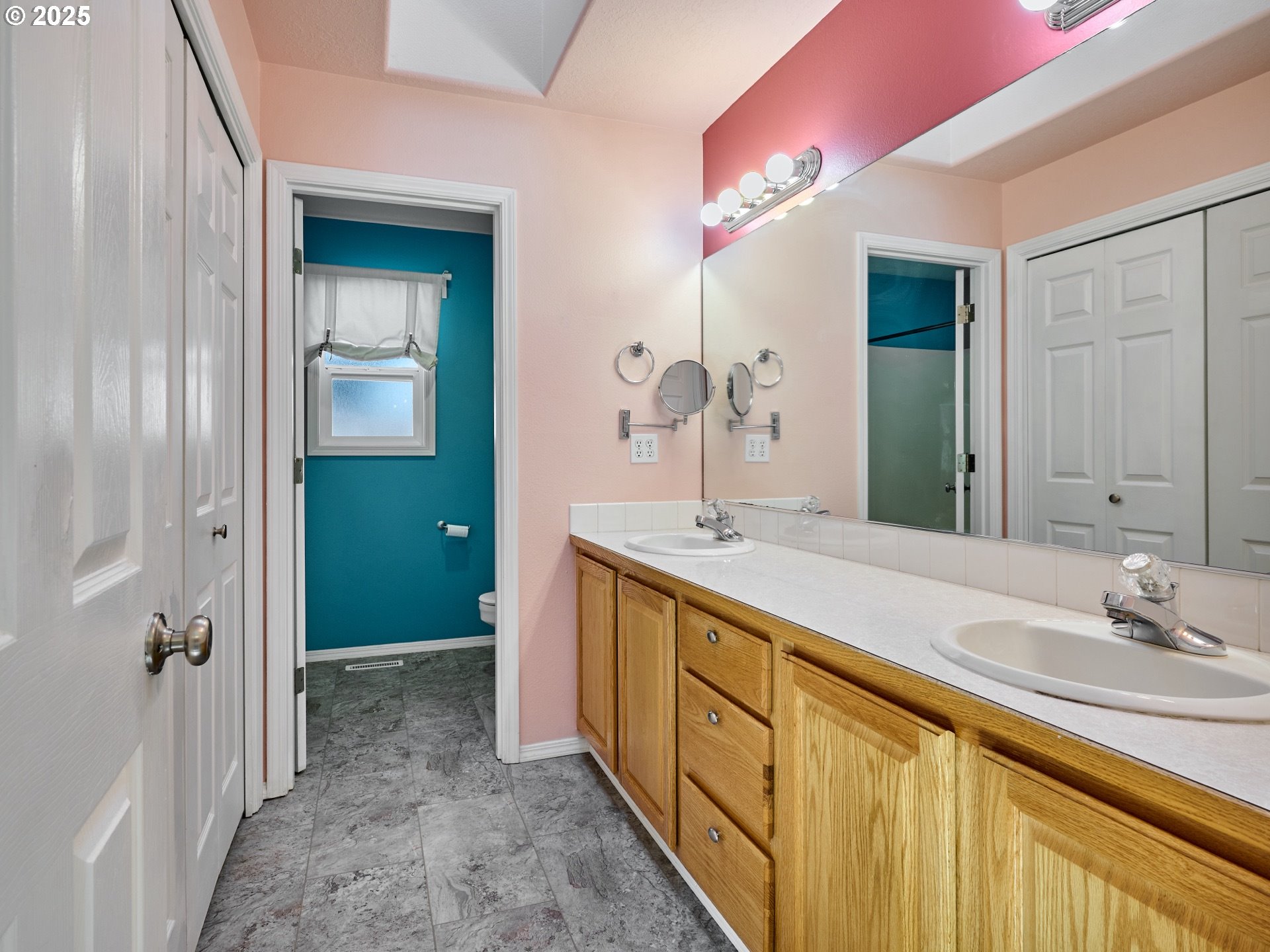 331 Southeast 9th Avenue Canby, OR 97013 - Photo 16 of 35 a spacious bathroom with a double vanity sink and a mirror