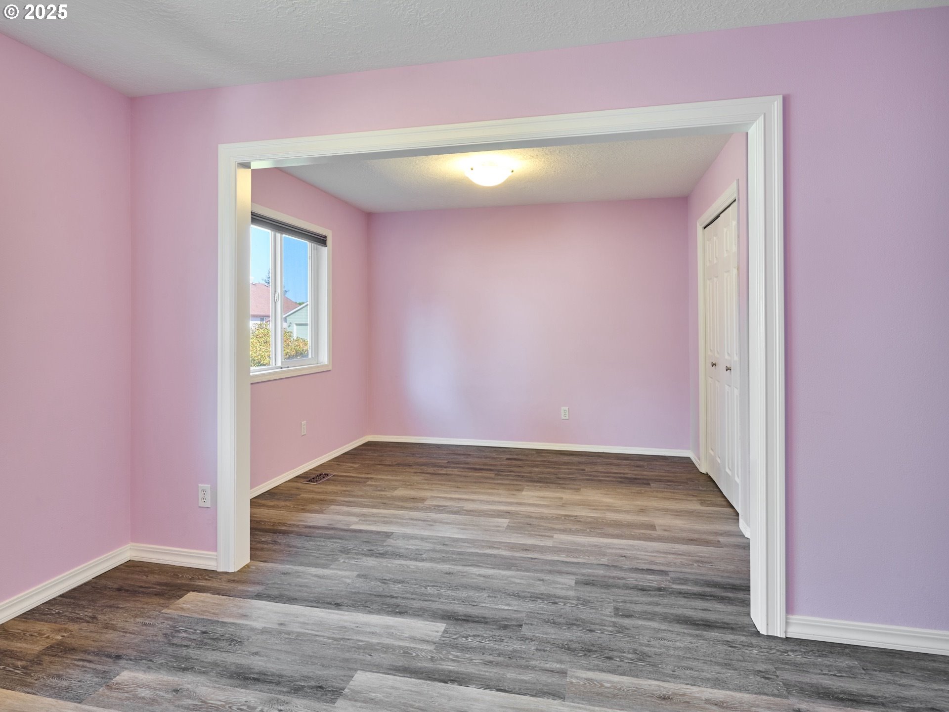 331 Southeast 9th Avenue Canby, OR 97013 - Photo 18 of 35 a view of an empty room with wooden floor and a window