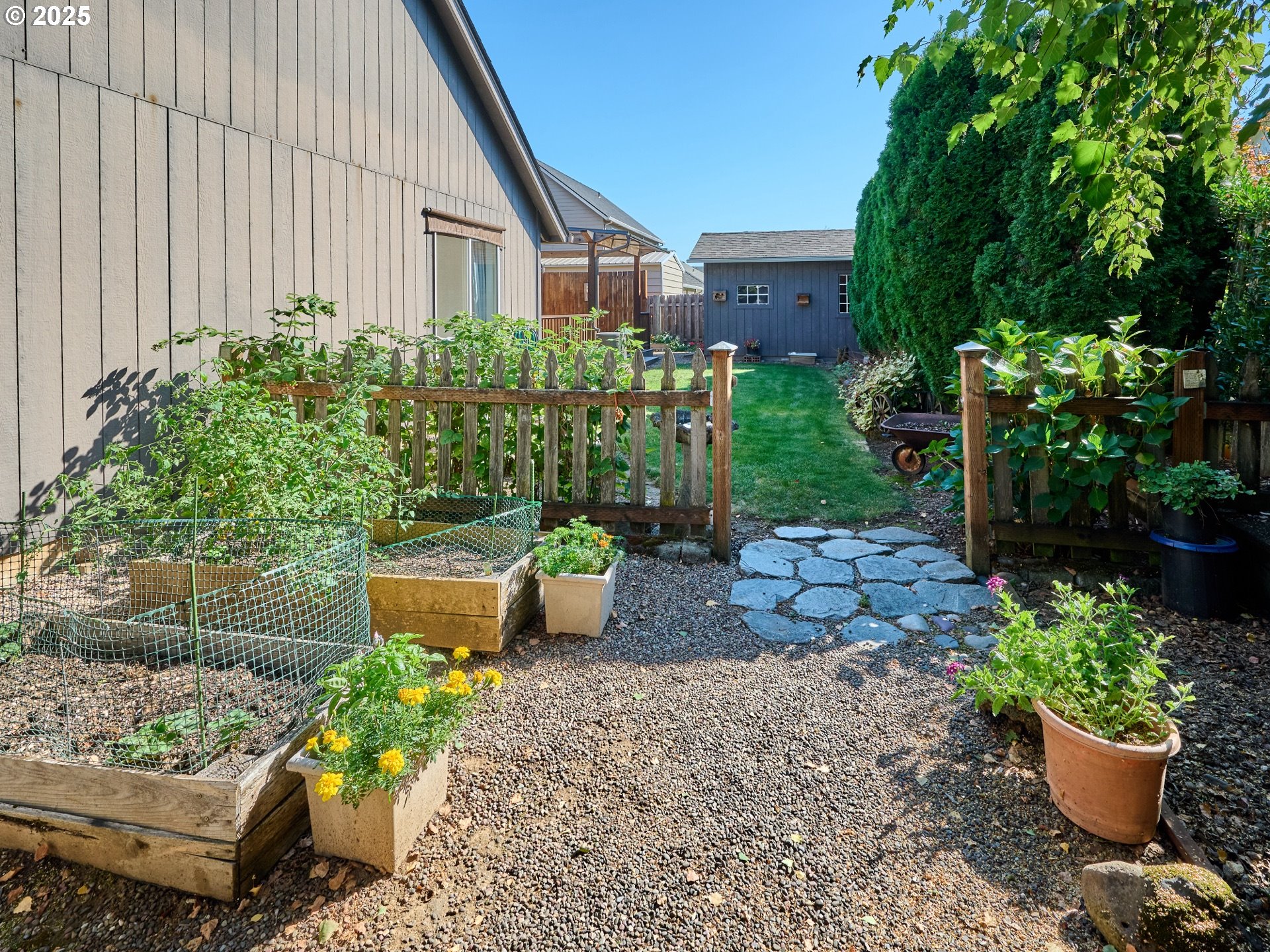 331 Southeast 9th Avenue Canby, OR 97013 - Photo 33 of 35 a view of a house with a backyard and sitting area