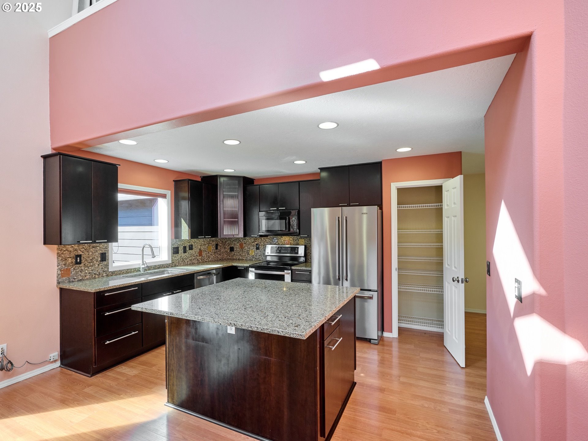 331 Southeast 9th Avenue Canby, OR 97013 - Photo 6 of 35 a kitchen with stainless steel appliances granite countertop a stove a refrigerator and a sink