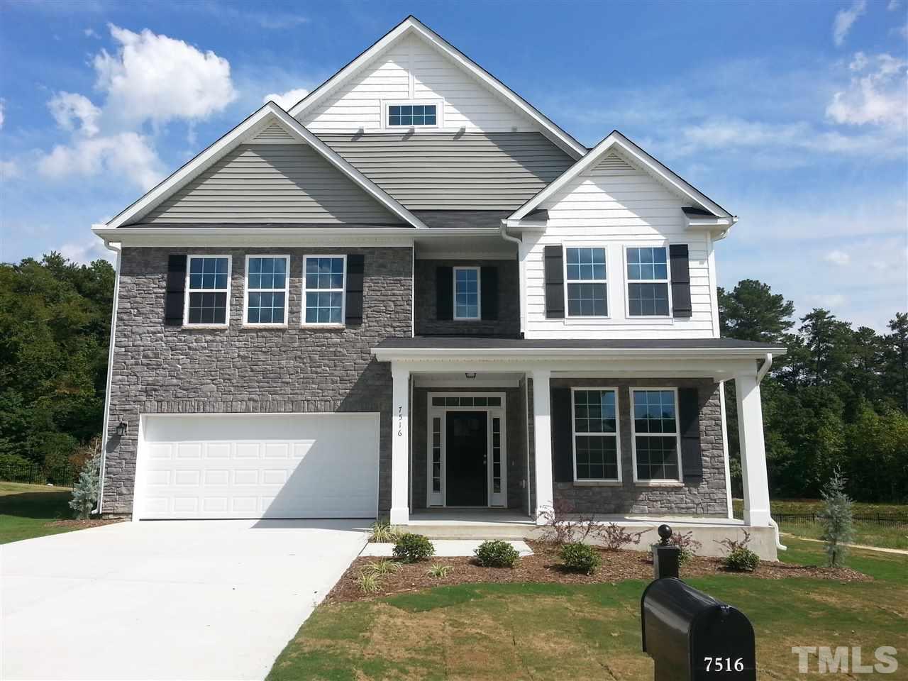 7516 Channery Way Raleigh, NC 27616 - Photo 1 of 25 front view of a house with a yard