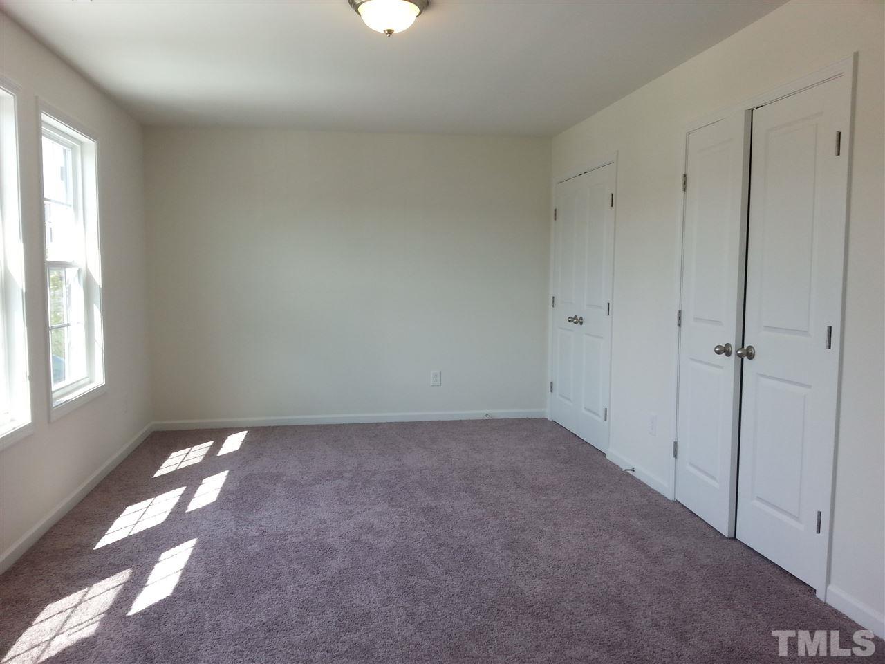 7516 Channery Way Raleigh, NC 27616 - Photo 11 of 25 a view of an empty room and a window