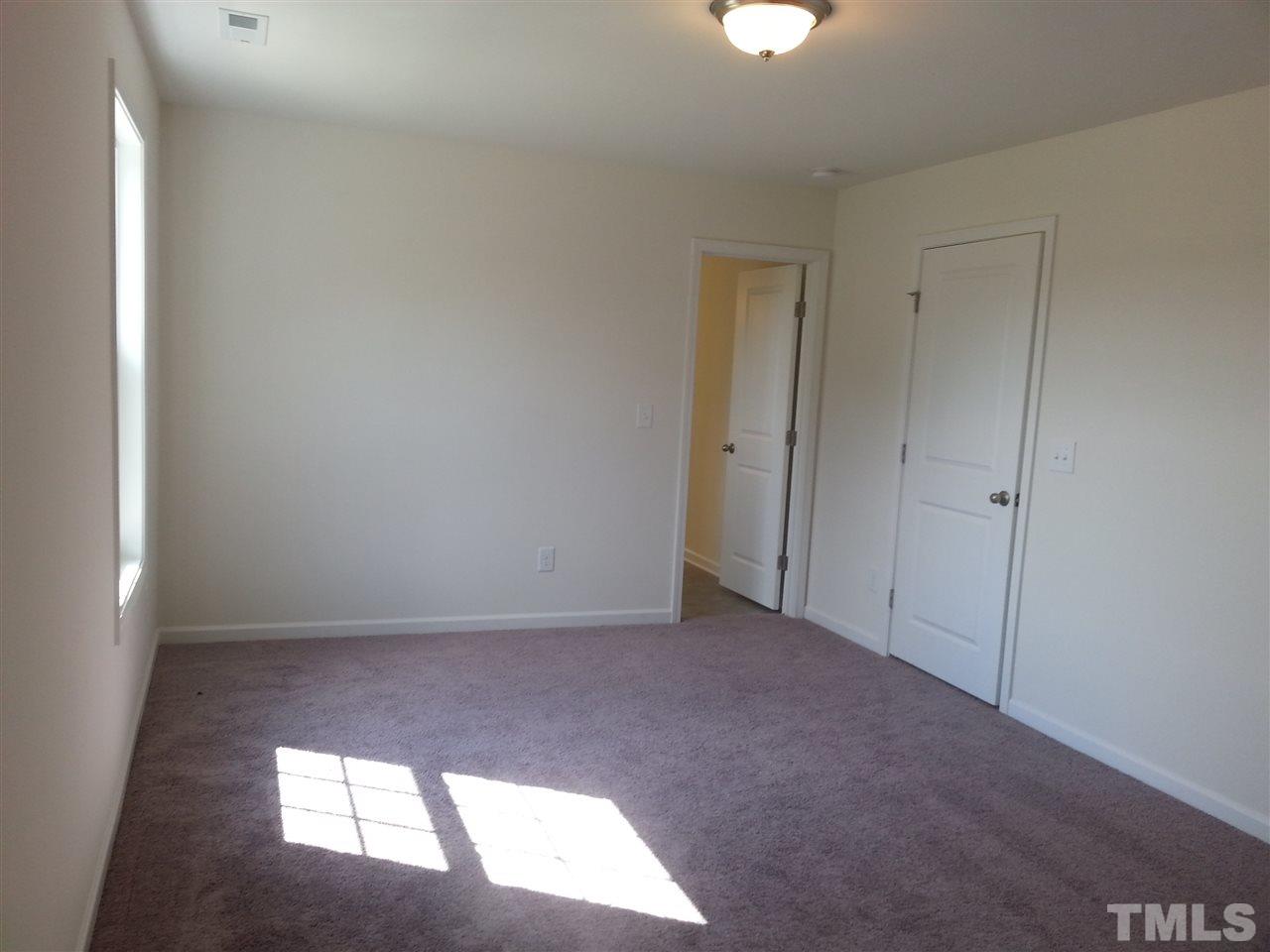 7516 Channery Way Raleigh, NC 27616 - Photo 13 of 25 a view of an empty room and window