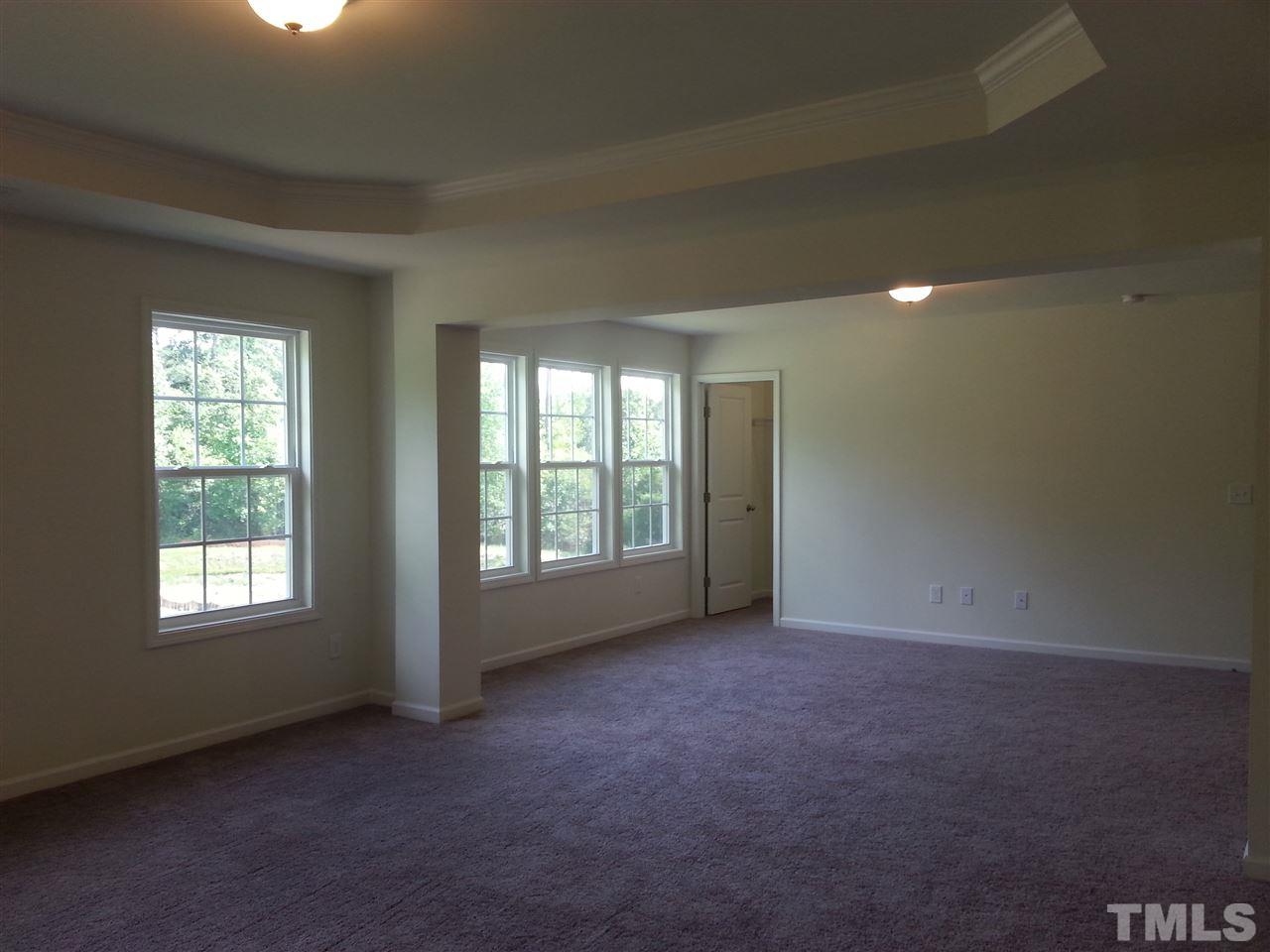 7516 Channery Way Raleigh, NC 27616 - Photo 20 of 25 an empty room with windows