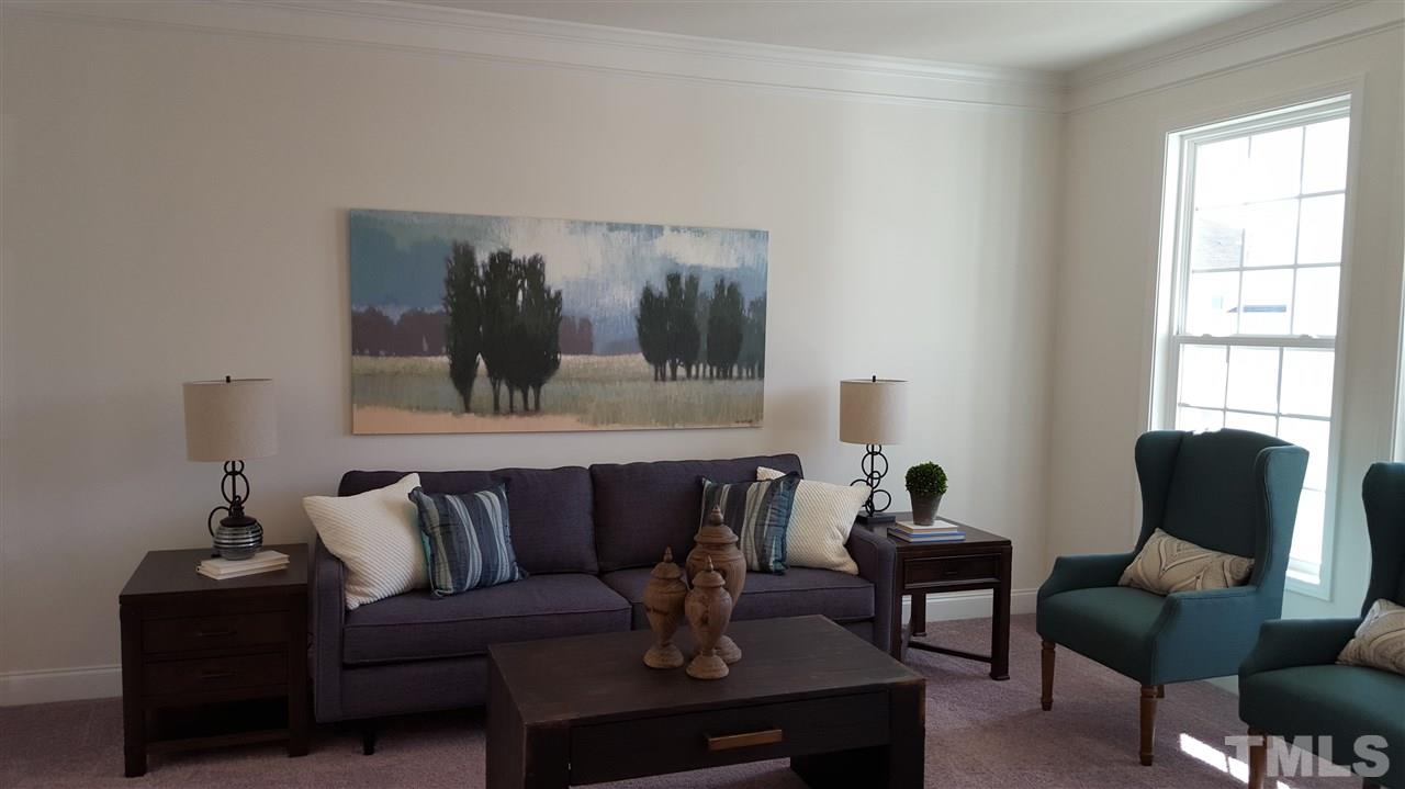 7516 Channery Way Raleigh, NC 27616 - Photo 3 of 25 a living room with furniture and a window
