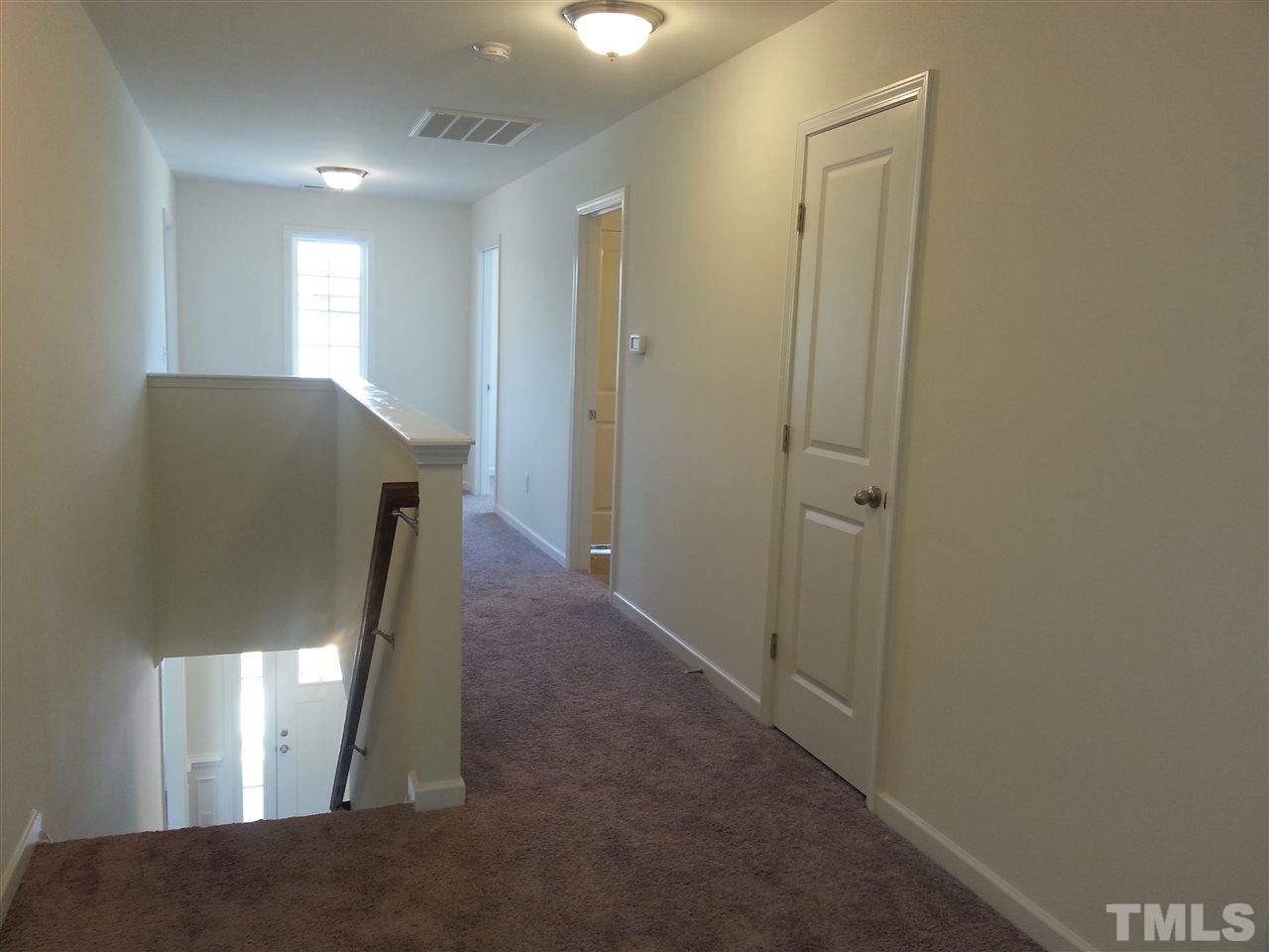 7516 Channery Way Raleigh, NC 27616 - Photo 8 of 25 a view of a hallway with entryway
