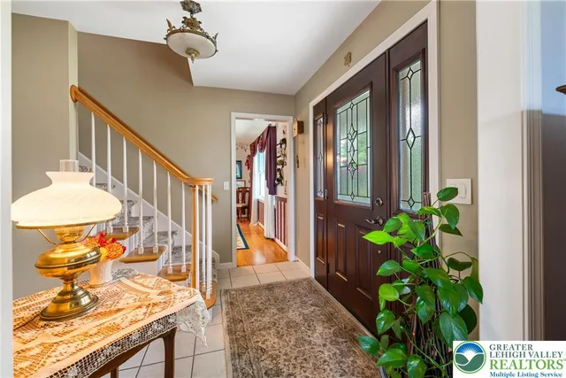 a kitchen with stainless steel appliances granite countertop a sink and a refrigerator