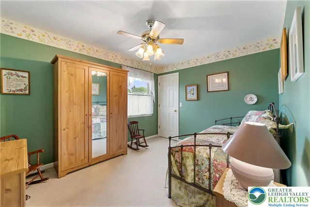 a bathroom with a sink a large mirror and a toilet
