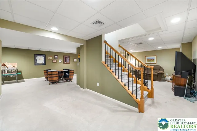 a view of a livingroom with furniture and bathroom