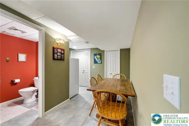 a view of a dining room with furniture and window