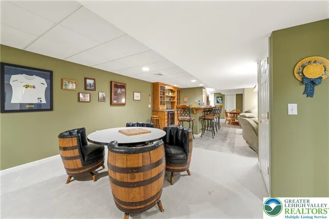 a room with patio furniture and a wooden floor