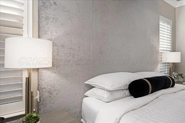 a bedroom with a bed and a night stand