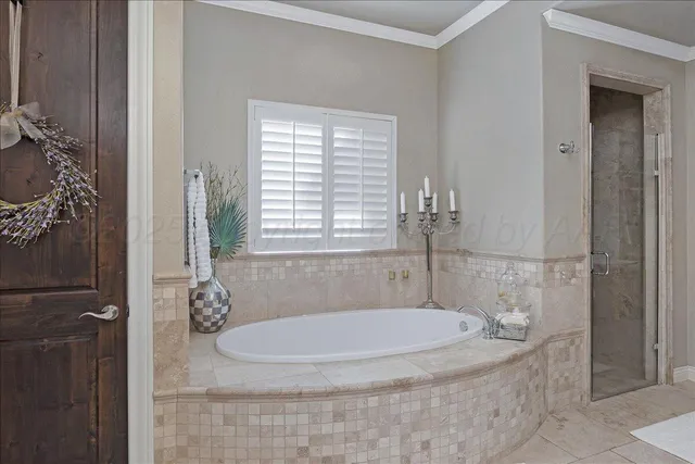 a bathroom with a granite countertop shower a window and a mirror