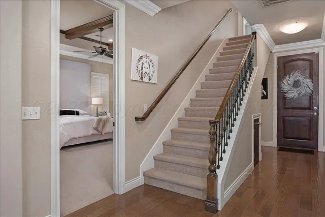 a view of entryway and hall with wooden floor