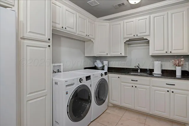 a kitchen with cabinets appliances and a window