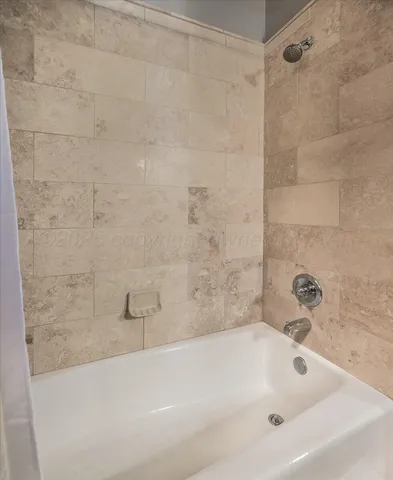 a bathroom with a bathtub