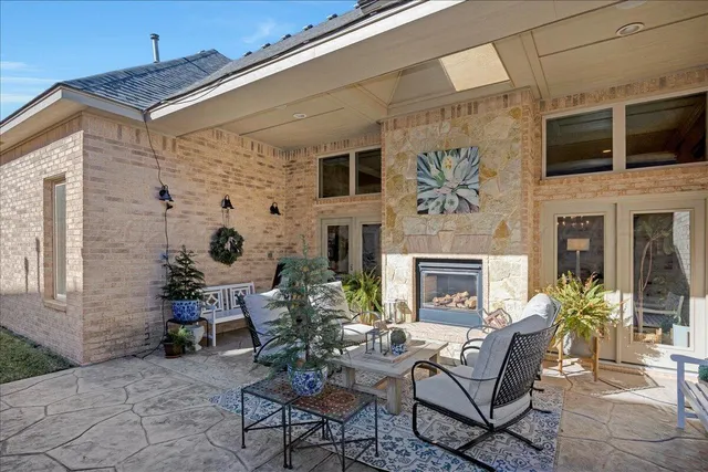a building outdoor space with patio furniture and potted plants