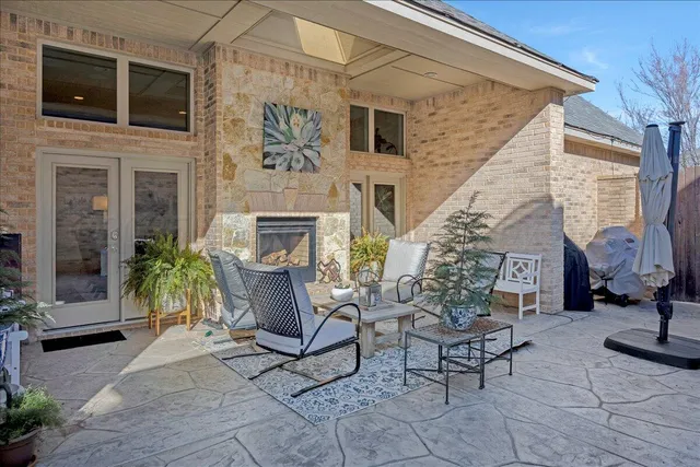 a building outdoor space with patio furniture and potted plants