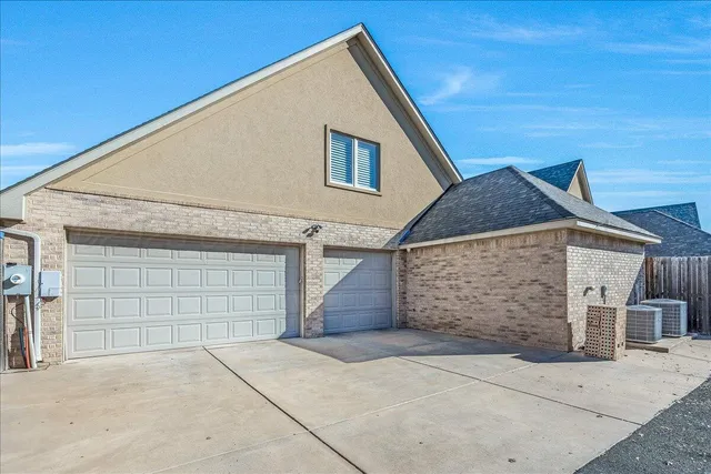 a view of house with garage