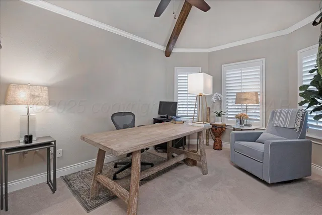 a view of a livingroom with furniture and a window
